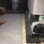 Close up of perimeter drainage channel in basement