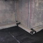 Cavity drain membrane applied to the floors and walls in basement