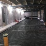 Cavity drain membrane installed on basement floor