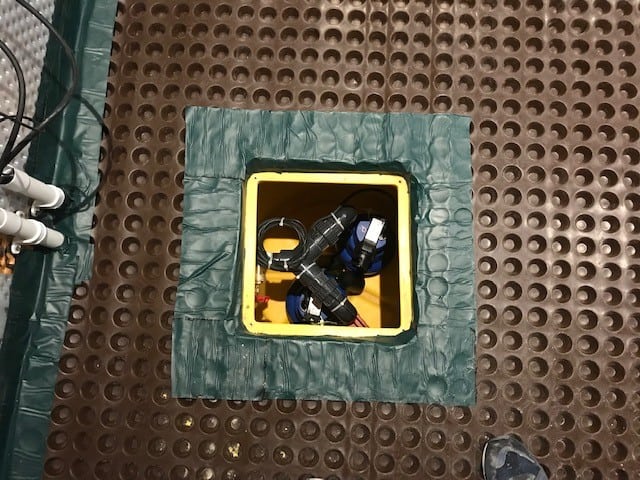 Closeup of sump pump inside chamber