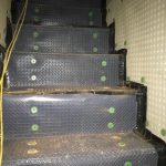 Cavity drain membrane fixed upon a stairwell