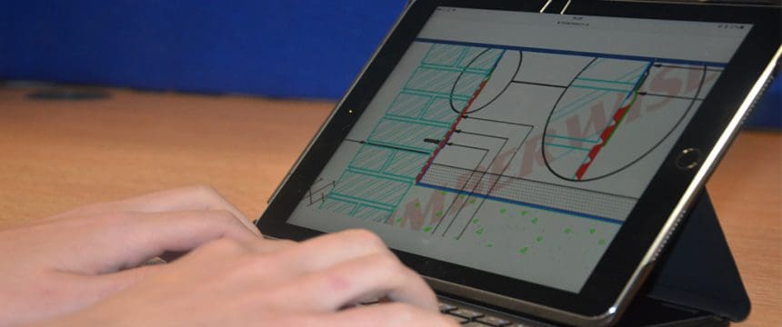 Closeup of surveyor designing a CAD diagram on an iPad