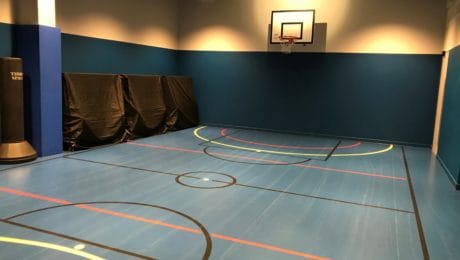Basement converted into indoor basketball court