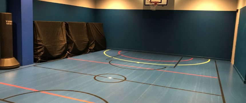 Basement converted into indoor basketball court