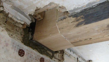 Closeup of replacing a timber beam in a home