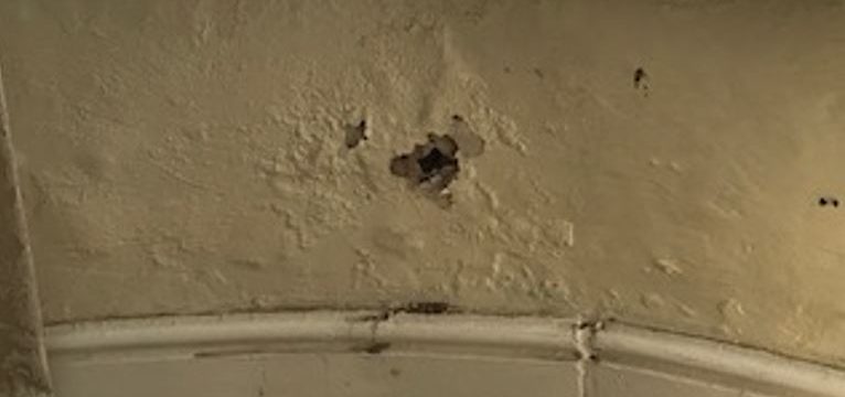 Damaged plaster on an interior wall