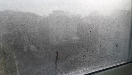 Condensation forming on inside of window in property