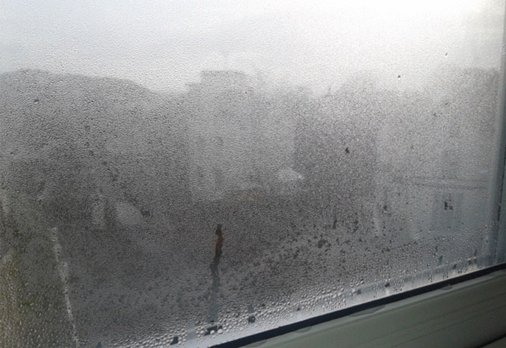 Signs of condensation on a window inside a property