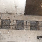 Closeup of damaged floor area in St Nicholas church