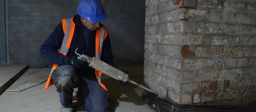 Timberwise engineer injecting a damp proof course