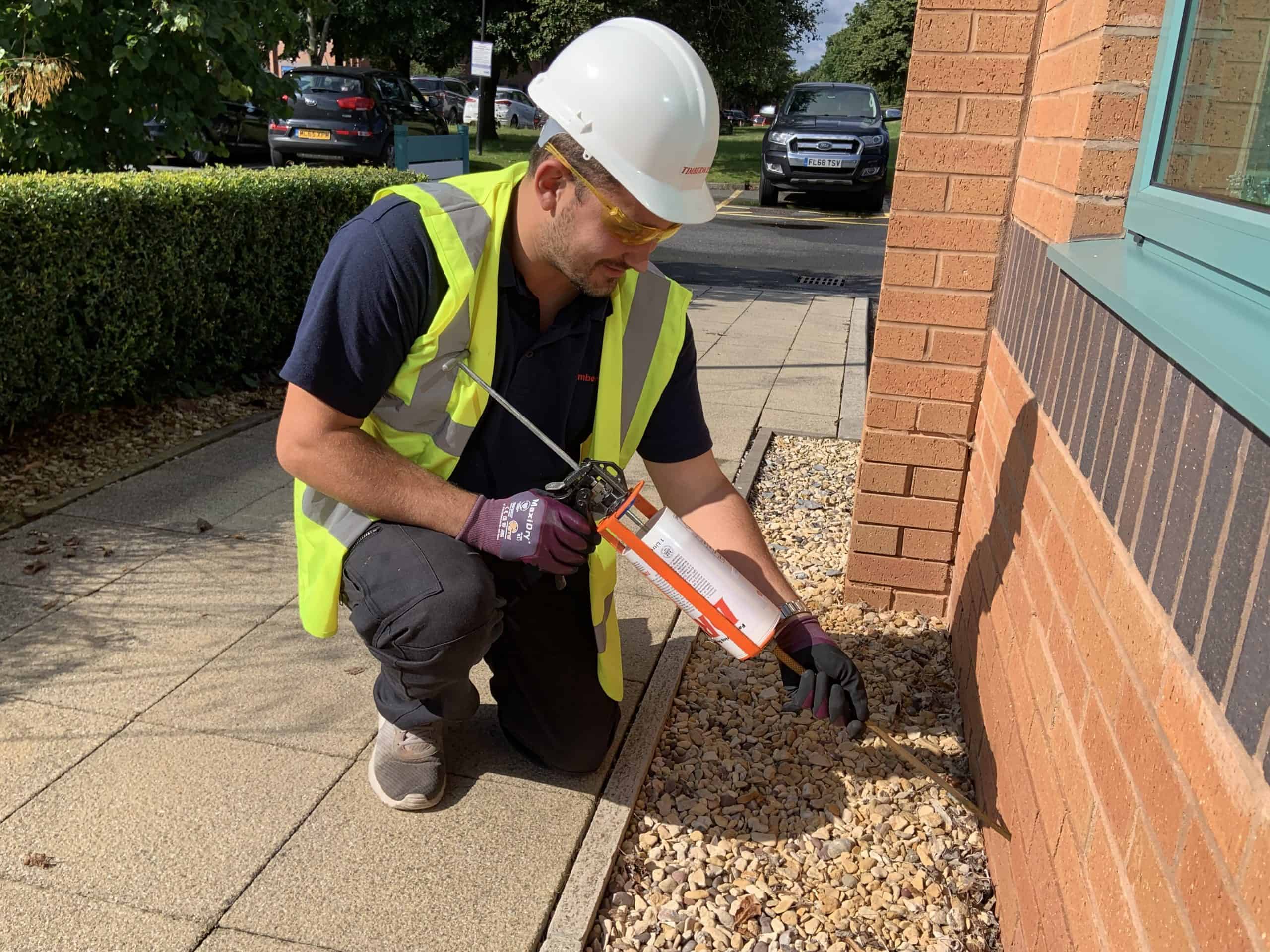 Damp Proof Course Installation A damp proof course being installed