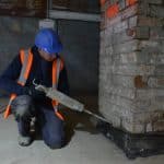 Injecting a damp proof course into a wall