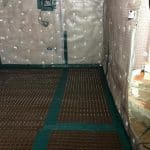 Walls and floor in a basement covered in cavity drain membrane Walls and floor in a basement covered in cavity drain membrane