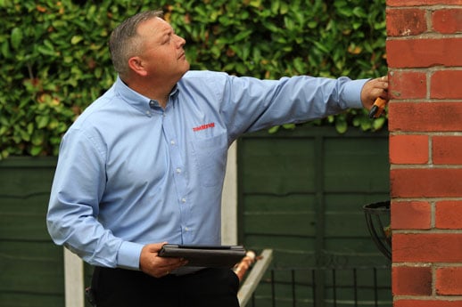 Surveyor providing a damp survey