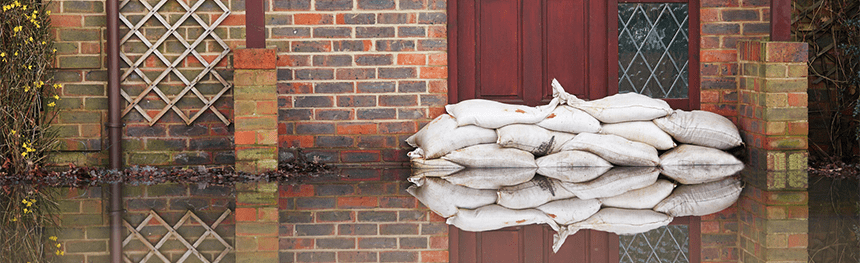 Closeup of sand bags protecting a property from flooding