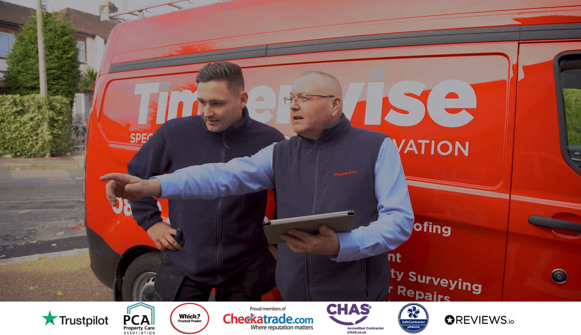 Two Timberwise workers in front of a van 