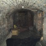 the void of the basement with an array of empty boxes