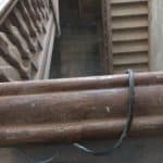 A view of staircases and wooden handrail A view of staircases and wooden handrail