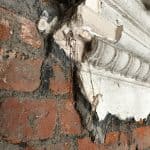 Close up of damaged plaster work on a wall Close up of damaged plaster work on a wall