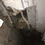 Damaged ceiling showing brick work with dry rot Damaged ceiling showing brick work with dry rot
