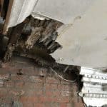Damaged internal ceiling and exposed brick work Damaged internal ceiling from dry rot and exposed brick work