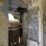 Damaged internal walls and a cast iron radiator Damaged internal walls and a cast iron radiator