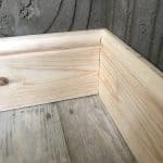 Close up shot of 2 skirting boards meeting Close up shot of 2 skirting boards meeting