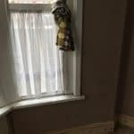 Window with net curtains and 1970's style curtains Window with net curtains and 1970's style curtains