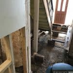 A hall way with the timber floor removed A hallway with the timber floor removed due to dry rot