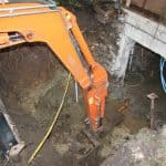 Closeup of a digger digging light well