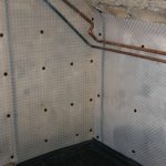 Membrane applied to wall in a basement