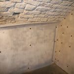 Closeup of membrane applied to wall in a basement