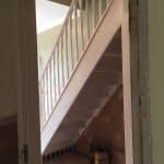 White staircase in a basement White staircase in a basement