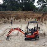 Digging out a basement with a mechanical digger