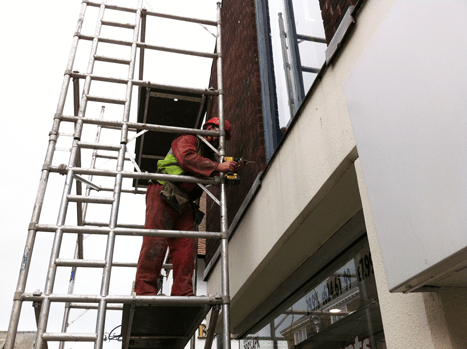 Inserting a cavity wall tie