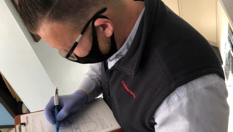 Surveyor carrying out internal wall checks