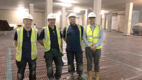 Four Timberwise engineers in a basement