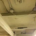 A ceiling in a basement