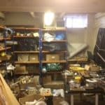 A messy, cluttered basement room