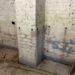 Basement wall in Liverpool partially covered in waterproofing membrane