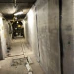 The hallway partially covered in waterproofing membrane in Liverpool basement
