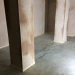 A supporting post in an empty retail unit A supporting post in an empty retail unit