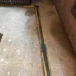 Salop Road - Channel install 1 Closeup of perimeter drainage channel being installed into Worcestershire basement