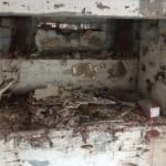 Salop Road - Strip Out 2 Closeup of walls in alcove in Worcestershire basement in the process of being stripped in preparation for waterproofing