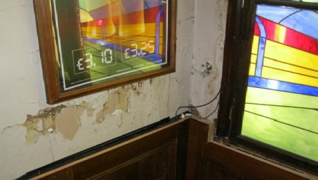 Salt contamination on a pub wall in South London