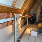 A Timberwise technician carrying out structural repairs to roof of school building