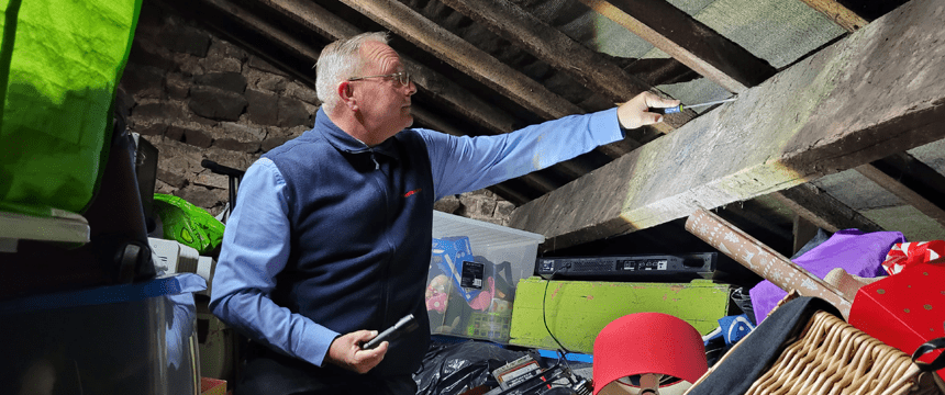 Surveyor Checking Loft