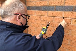 Surveyor conducting a cavity wall tie survey