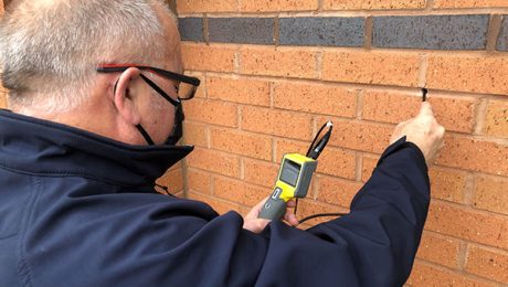 Surveyor conducting a cavity wall tie survey