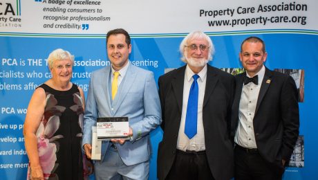 Surveyor collecting an award at the PCA awards